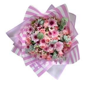 Bouquet of pink roses and chrysanthemums wrapped in pink striped paper